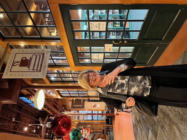 Gail Kauranen Jones laughing as she walks into Jabberwocky Bookshop to launch Born Worthy