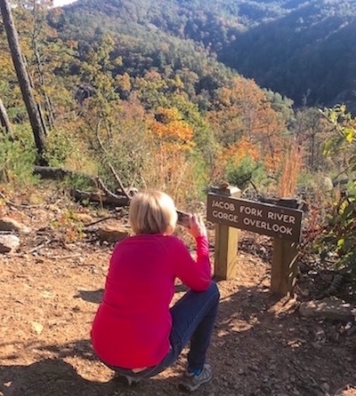 Gail Kauranen Jones pausing on a mountain path