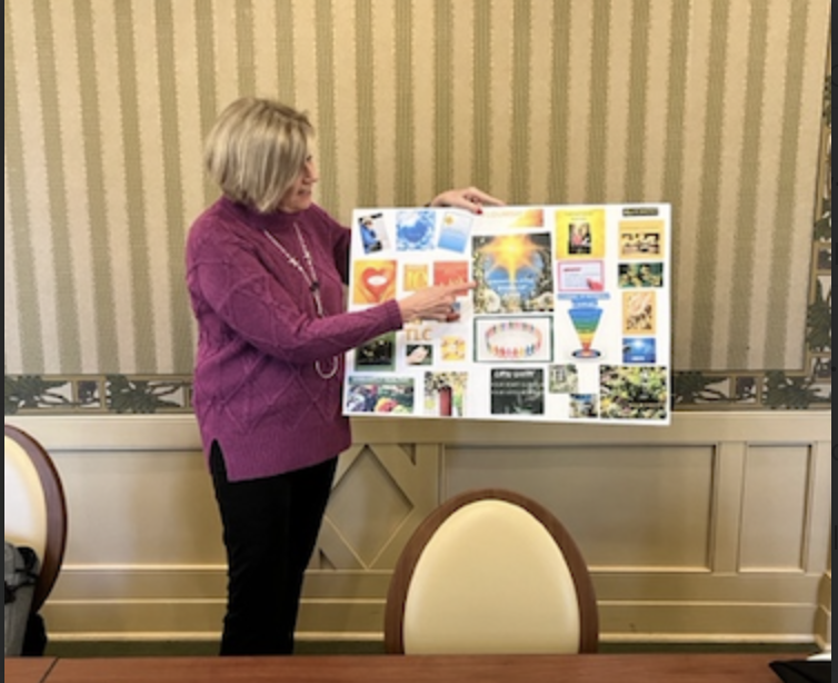 Gail presenting a vision board during a workshop